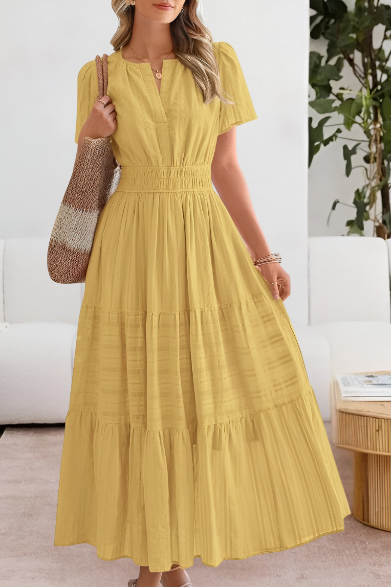 Lera – Maxikleid mit Smock-Details und Stufen - Gelb