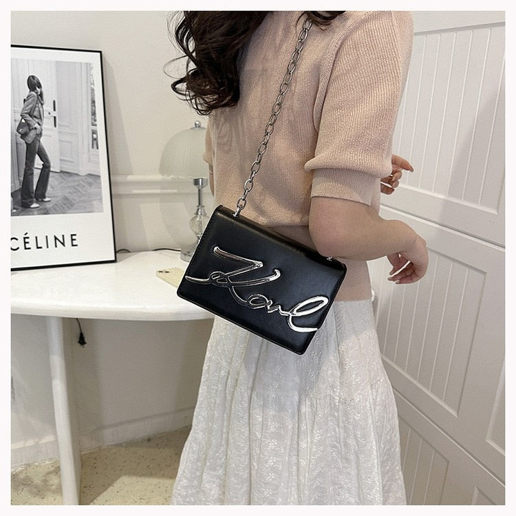 EliteElegance - Lagerfeld Sling Handtasche